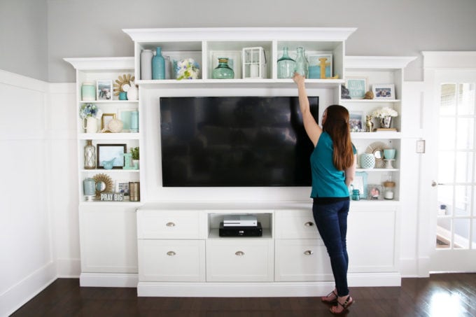 It can be a challenge to know how to decorate shelves, but this foolproof formula will teach you how to style shelves beautifully in no time! | #shelfie #shelfstyling #styledshelves #bookshelfstyling #livingroom #livingroomdecor #summerdecor #vignette Decorating Shelves for Summer, Shelf Styling on a Large, White Entertainment Unit