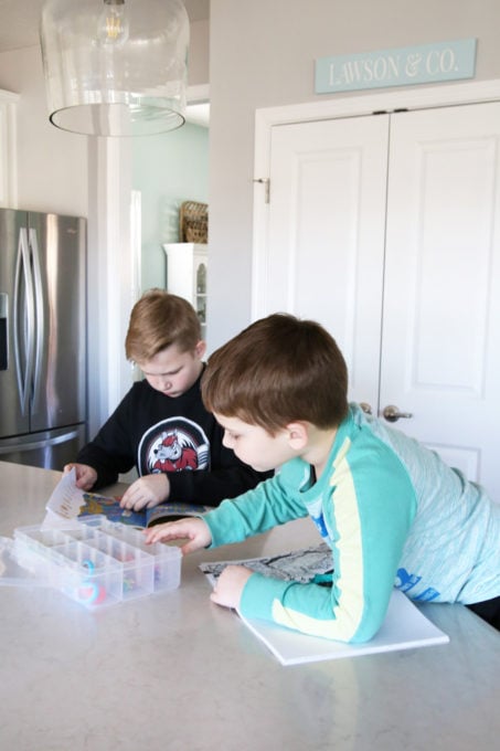 Kids Coloring with Supplies from a Portable, Organized Art Station, This simple portable, organized kids' art station makes it easy for kids to be creative anywhere in the house! | #artstation #artsupplies #organizedkids #organization #organized #organizedwithkids