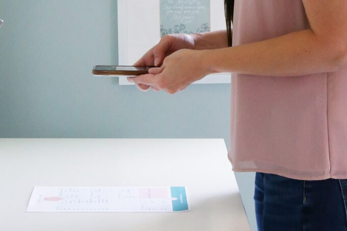 Woman scanning a document using her smart phone