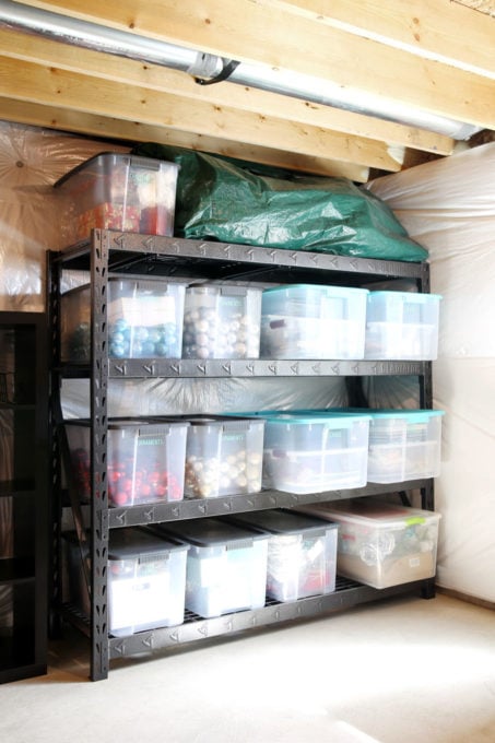 Organized Holiday Decor Bins in a Basement on Shelving