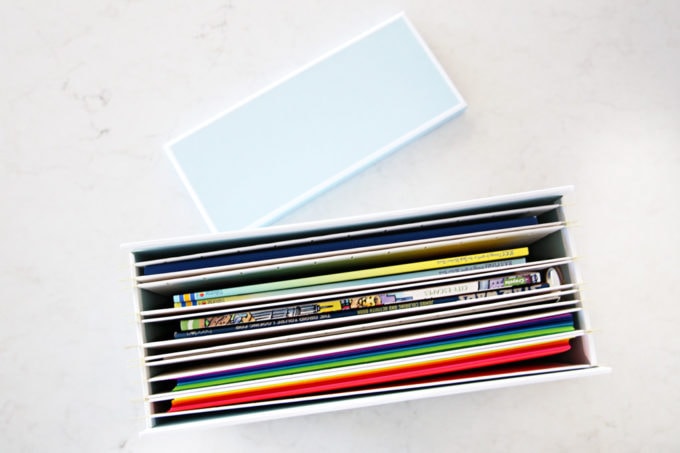 Coloring Books and Art Paper in an Organized File Box, This simple portable, organized kids' art station makes it easy for kids to be creative anywhere in the house! | #artstation #artsupplies #organizedkids #organization #organized #organizedwithkids