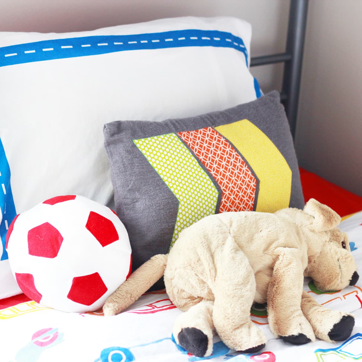 Pillows and Stuffed Toys Laying on a Kid's Bed