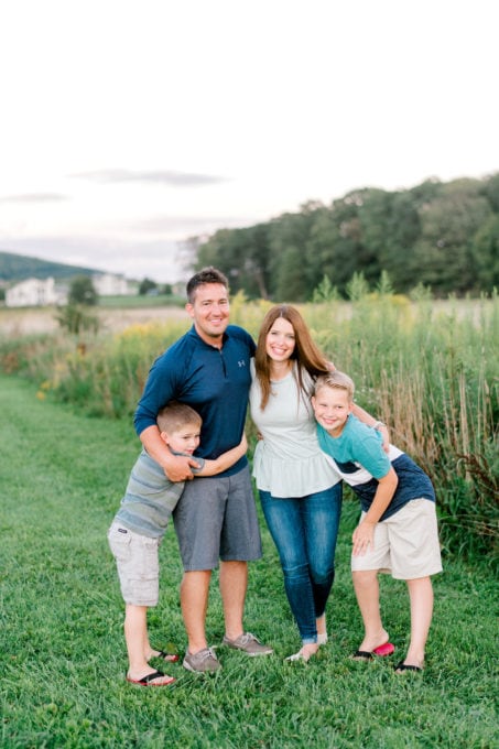 Smiling family in a field