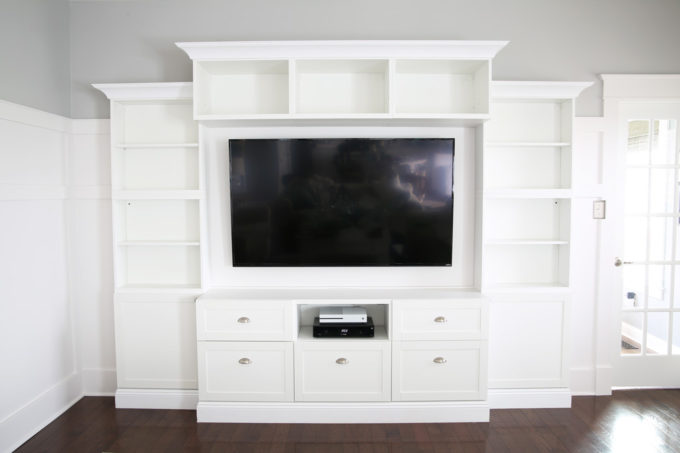 It can be a challenge to know how to decorate shelves, but this foolproof formula will teach you how to style shelves beautifully in no time! | #shelfie #shelfstyling #styledshelves #bookshelfstyling #livingroom #livingroomdecor #summerdecor #vignette Living Room Entertainment Unit with Completely Bare Shelves