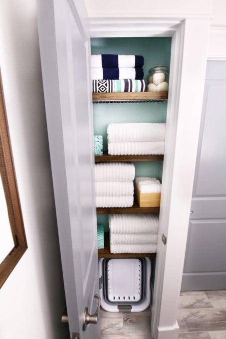 Small, Organized Linen Closet in a Laundry Room