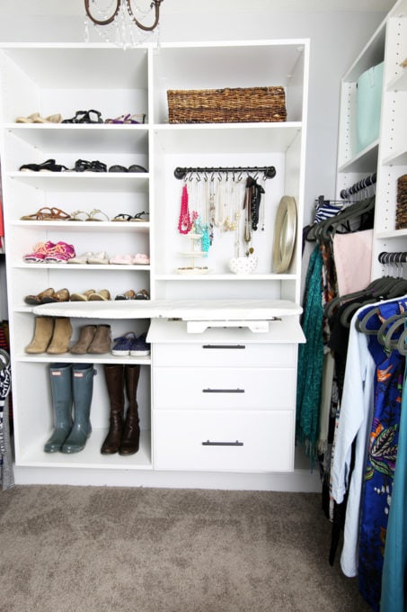 Closet system with built in ironing board