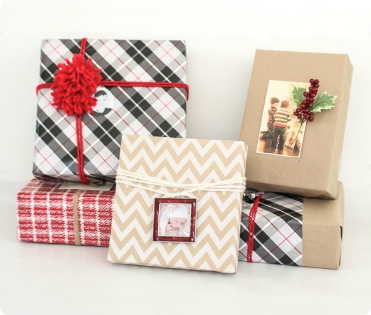 Five gift wrapped boxes with cute photos as tags.