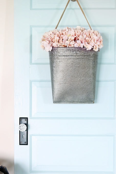 Aqua paint colors can be tough to sort through to find the perfect blend of blue and green for your space, so I'm sharing my 10 favorite aqua paint colors that will make any room feel soothing and serene! | #aqua #aquapaintcolors #aquapaint #mintpaint #mintpaintcolors #paintcolors #bestpaintcolors , Painted Door in Behr Clear Pond at Half Strength