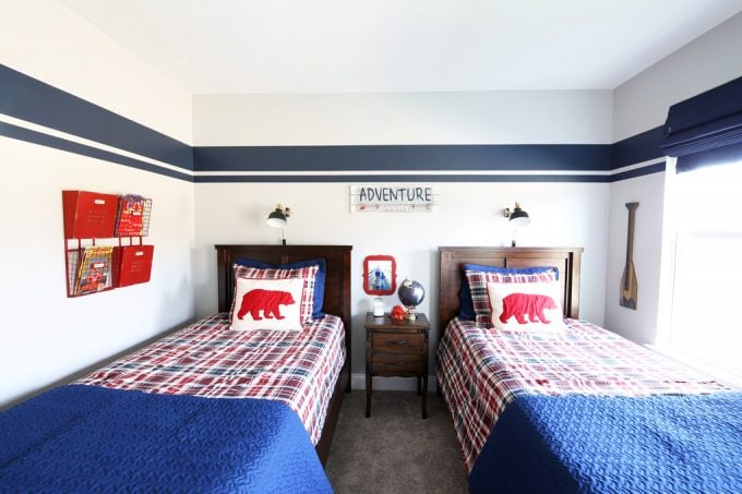 Shared boy bedroom with a small nightstand between two twin beds