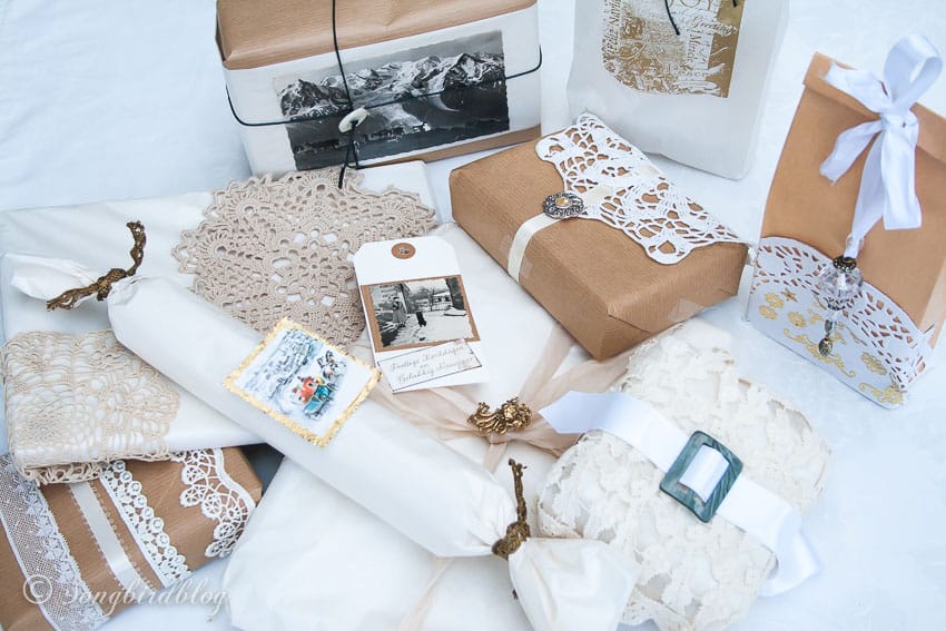 A bunch of Christmas gifts decorated in vintage dollies wrapped for Christmas.