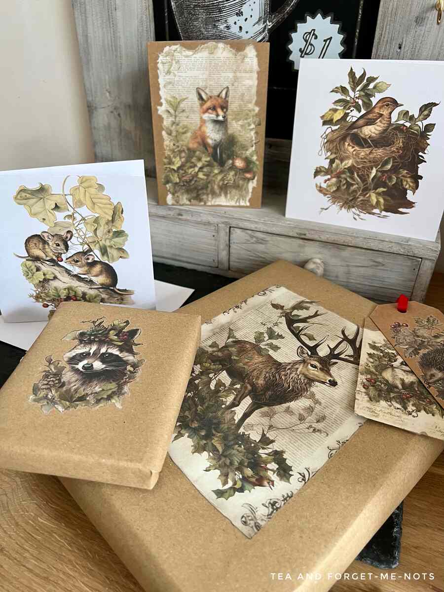 A set of woodland pictures decoupaged on top of brown wrapping paper.