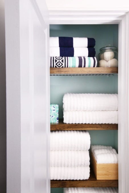 Organized Small Linen Closet with Folded Towels