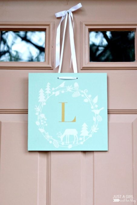 Aqua paint colors can be tough to sort through to find the perfect blend of blue and green for your space, so I'm sharing my 10 favorite aqua paint colors that will make any room feel soothing and serene! | #aqua #aquapaintcolors #aquapaint #mintpaint #mintpaintcolors #paintcolors #bestpaintcolors , Door Decor Painted in Behr Marina Isle